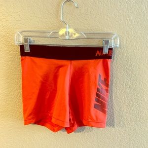 Red-Orange Nike running shorts